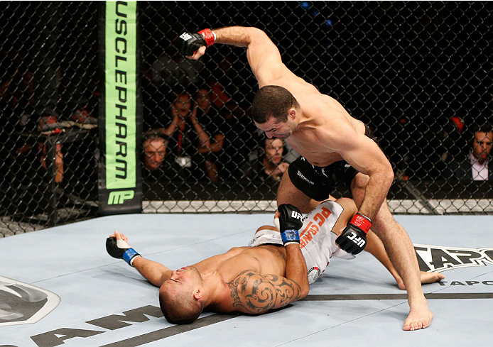 BRISBANE, AUSTRALIA - DECEMBER 07: (R-L) Mauricio "Shogun" Rua knocks out James Te Huna with a punch in their light heavyweight fight during the UFC Fight Night event at the Brisbane Entertainment Centre on December 7, 2013 in Brisbane, Australia. (Photo