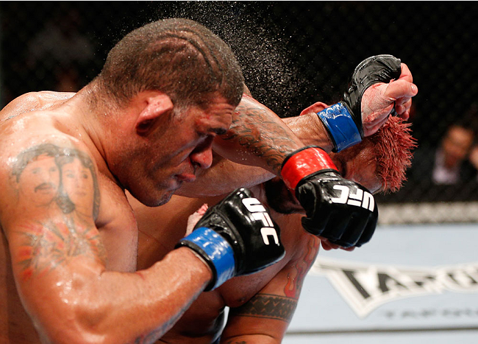 BRISBANE, AUSTRALIA - DECEMBER 07: (R-L) Mark Hunt punches Antonio "Bigfoot" Silva in their heavyweight fight during the UFC Fight Night event at the Brisbane Entertainment Centre on December 7, 2013 in Brisbane, Australia. (Photo by Josh Hedges/Zuffa LL