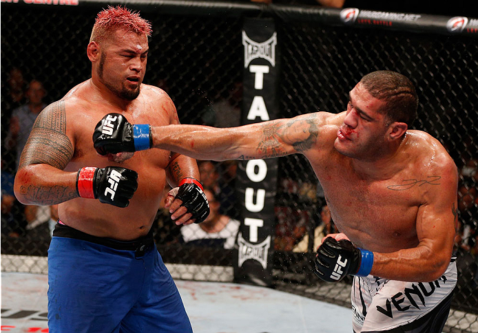 BRISBANE, AUSTRALIA - DECEMBER 07: (R-L) Antonio "Bigfoot" Silva punches Mark Hunt in their heavyweight fight during the UFC Fight Night event at the Brisbane Entertainment Centre on December 7, 2013 in Brisbane, Australia. (Photo by Josh Hedges/Zuffa LL