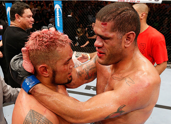 BRISBANE, AUSTRALIA - DECEMBER 07: (R-L) Opponents Antonio "Bigfoot" Silva and Mark Hunt congratulate one another after their five-round heavyweight fight during the UFC Fight Night event at the Brisbane Entertainment Centre on December 7, 2013 in Brisba