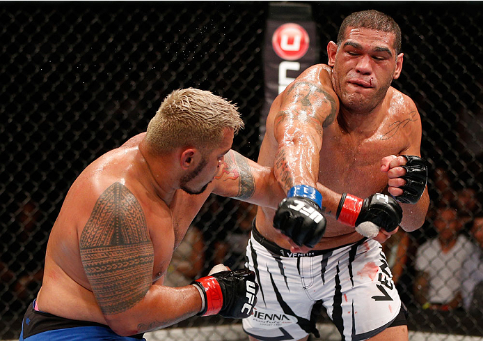 BRISBANE, AUSTRALIA - DECEMBER 07: (R-L) Antonio "Bigfoot" Silva punches Mark Hunt in their heavyweight fight during the UFC Fight Night event at the Brisbane Entertainment Centre on December 7, 2013 in Brisbane, Australia. (Photo by Josh Hedges/Zuffa LL