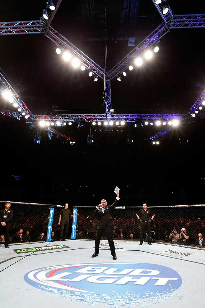 BRISBANE, AUSTRALIA - DECEMBER 07: Octagon announcer Bruce Buffer introduces the main event fighters during the UFC Fight Night event at the Brisbane Entertainment Centre on December 7, 2013 in Brisbane, Australia. (Photo by Josh Hedges/Zuffa LLC/Zuffa L