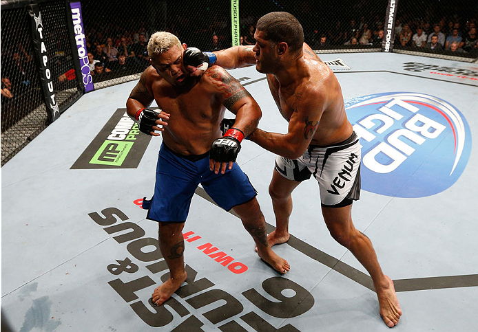 BRISBANE, AUSTRALIA - DECEMBER 07: (R-L) Antonio "Bigfoot" Silva punches Mark Hunt in their heavyweight fight during the UFC Fight Night event at the Brisbane Entertainment Centre on December 7, 2013 in Brisbane, Australia. (Photo by Josh Hedges/Zuffa LL