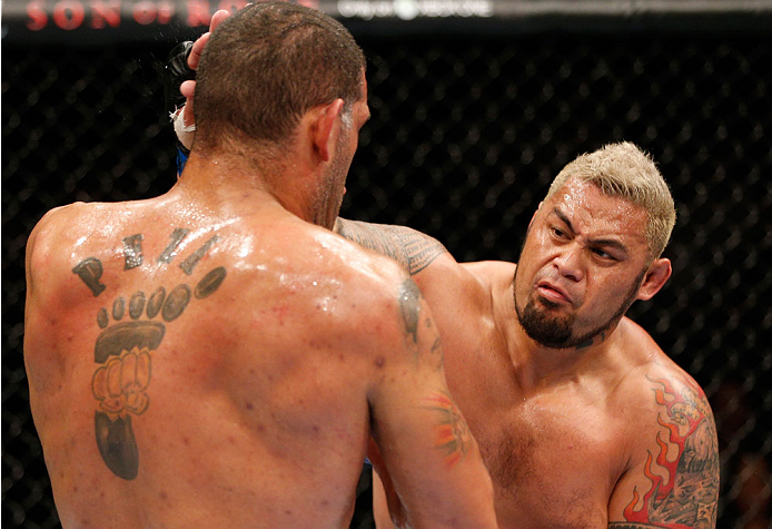 BRISBANE, AUSTRALIA - DECEMBER 07: (R-L) Mark Hunt punches Antonio "Bigfoot" Silva in their heavyweight fight during the UFC Fight Night event at the Brisbane Entertainment Centre on December 7, 2013 in Brisbane, Australia. (Photo by Josh Hedges/Zuffa LL