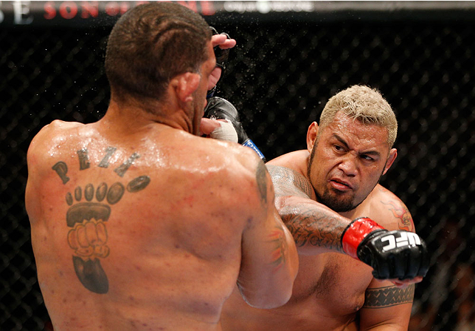 BRISBANE, AUSTRALIA - DECEMBER 07: (R-L) Mark Hunt punches Antonio "Bigfoot" Silva in their heavyweight fight during the UFC Fight Night event at the Brisbane Entertainment Centre on December 7, 2013 in Brisbane, Australia. (Photo by Josh Hedges/Zuffa LL