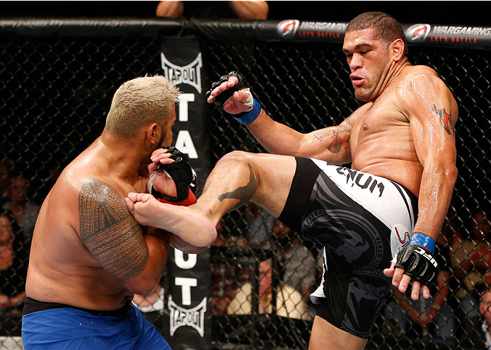 BRISBANE, AUSTRALIA - DECEMBER 07: (R-L) Antonio "Bigfoot" Silva kicks Mark Hunt in their heavyweight fight during the UFC Fight Night event at the Brisbane Entertainment Centre on December 7, 2013 in Brisbane, Australia. (Photo by Josh Hedges/Zuffa LLC/