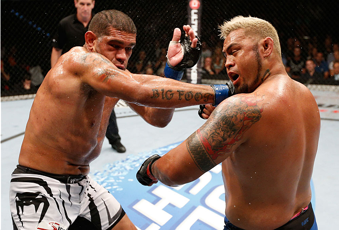 BRISBANE, AUSTRALIA - DECEMBER 07: (L-R) Antonio "Bigfoot" Silva punches Mark Hunt in their heavyweight fight during the UFC Fight Night event at the Brisbane Entertainment Centre on December 7, 2013 in Brisbane, Australia. (Photo by Josh Hedges/Zuffa LL