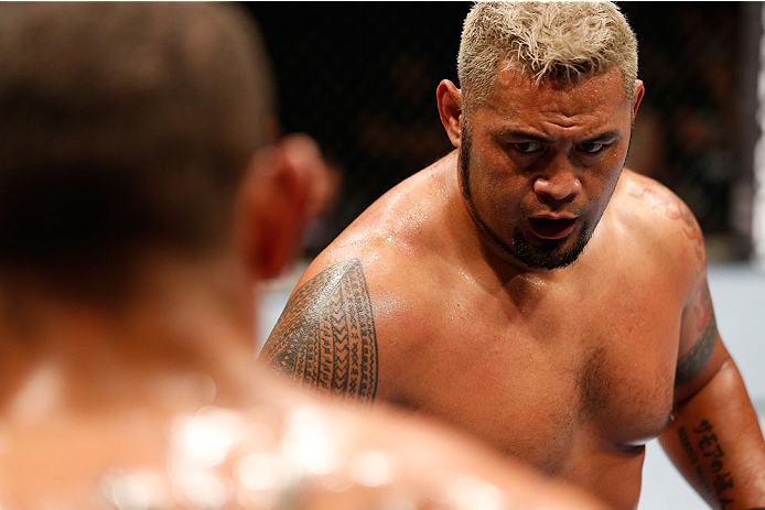 BRISBANE, AUSTRALIA - DECEMBER 07: (R-L) Mark Hunt squares off with Antonio "Bigfoot" Silva in their heavyweight fight during the UFC Fight Night event at the Brisbane Entertainment Centre on December 7, 2013 in Brisbane, Australia. (Photo by Josh Hedges