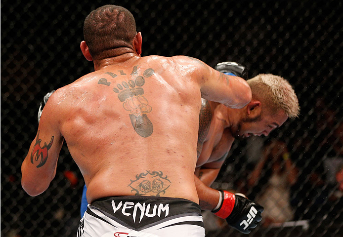 BRISBANE, AUSTRALIA - DECEMBER 07: (L-R) Antonio "Bigfoot" Silva punches Mark Hunt in their heavyweight fight during the UFC Fight Night event at the Brisbane Entertainment Centre on December 7, 2013 in Brisbane, Australia. (Photo by Josh Hedges/Zuffa LL