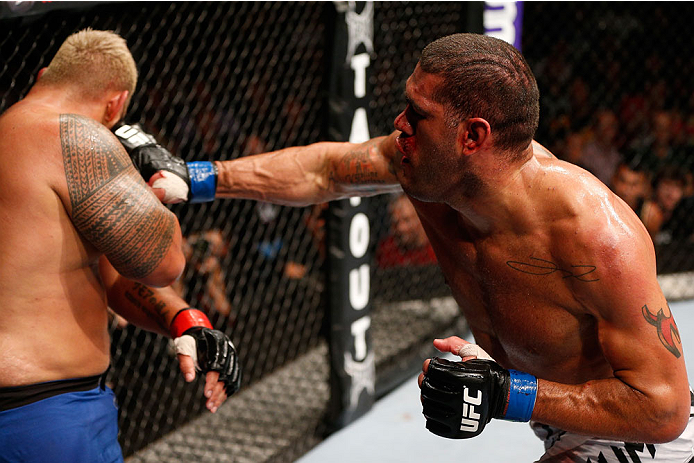 BRISBANE, AUSTRALIA - DECEMBER 07: (R-L) Antonio "Bigfoot" Silva punches Mark Hunt in their heavyweight fight during the UFC Fight Night event at the Brisbane Entertainment Centre on December 7, 2013 in Brisbane, Australia. (Photo by Josh Hedges/Zuffa LL