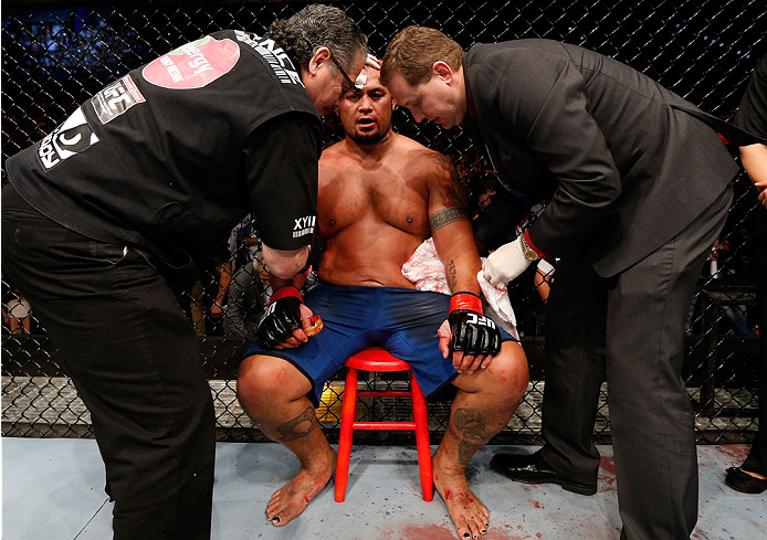 BRISBANE, AUSTRALIA - DECEMBER 07: Mark Hunt is treated in his corner after his heavyweight fight against Antonio "Bigfoot" Silva during the UFC Fight Night event at the Brisbane Entertainment Centre on December 7, 2013 in Brisbane, Australia. (Photo by