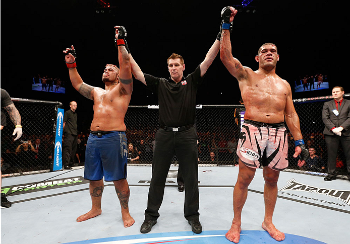 BRISBANE, AUSTRALIA - DECEMBER 07: The heavyweight fight between Mark Hunt (L) and Antonio "Bigfoot" Silva (R) is declared a majority draw during the UFC Fight Night event at the Brisbane Entertainment Centre on December 7, 2013 in Brisbane, Australia. (
