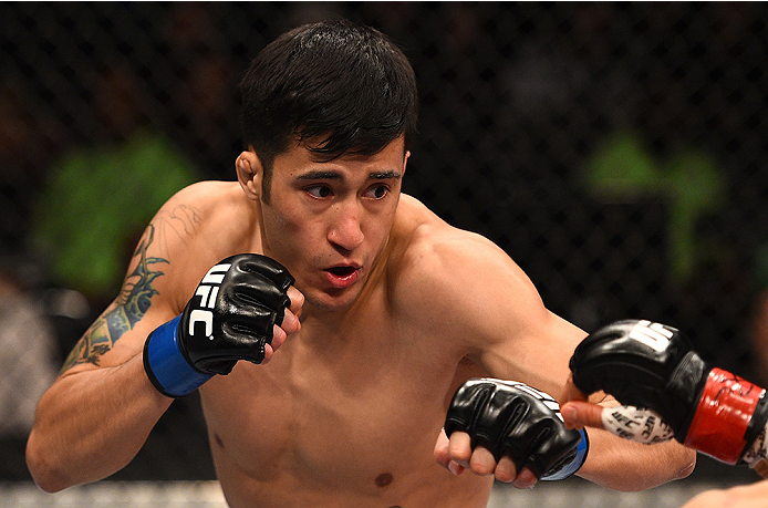 BOSTON, MA - JANUARY 18:  Joby Sanchez punches Tateki Matsuda in their flyweight fight during the UFC Fight Night event at the TD Garden on January 18, 2015 in Boston, Massachusetts. (Photo by Jeff Bottari/Zuffa LLC/Zuffa LLC via Getty Images)