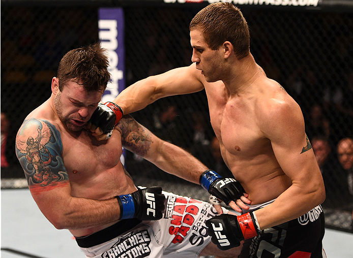 BOSTON, MA - JANUARY 18:  (R-L) Matt Van Buren punches Sean O'Connell in their light heavyweight fight during the UFC Fight Night event at the TD Garden on January 18, 2015 in Boston, Massachusetts. (Photo by Jeff Bottari/Zuffa LLC/Zuffa LLC via Getty Ima