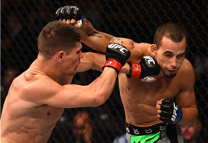 BOSTON, MA - JANUARY 18:  (R-L) Sean Soriano punches Charles Rosa in their featherweight fight during the UFC Fight Night event at the TD Garden on January 18, 2015 in Boston, Massachusetts. (Photo by Jeff Bottari/Zuffa LLC/Zuffa LLC via Getty Images)