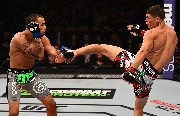 BOSTON, MA - JANUARY 18: (R-L) Charles Rosa kicks Sean Soriano in their featherweight fight during the UFC Fight Night event at the TD Garden on January 18, 2015 in Boston, Massachusetts. (Photo by Jeff Bottari/Zuffa LLC/Zuffa LLC via Getty Images)