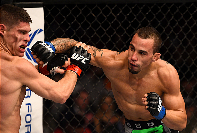 BOSTON, MA - JANUARY 18: (R-L) Sean Soriano punches Charles Rosa in their featherweight fight during the UFC Fight Night event at the TD Garden on January 18, 2015 in Boston, Massachusetts. (Photo by Jeff Bottari/Zuffa LLC/Zuffa LLC via Getty Images)
