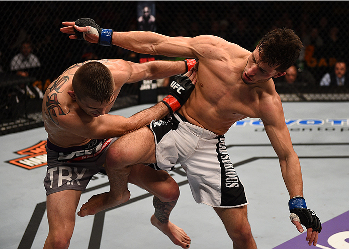 BOSTON, MA - JANUARY 18:  (R-L) Frankie Perez kicks Johnny Case in their lightweight fight during the UFC Fight Night event at the TD Garden on January 18, 2015 in Boston, Massachusetts. (Photo by Jeff Bottari/Zuffa LLC/Zuffa LLC via Getty Images)