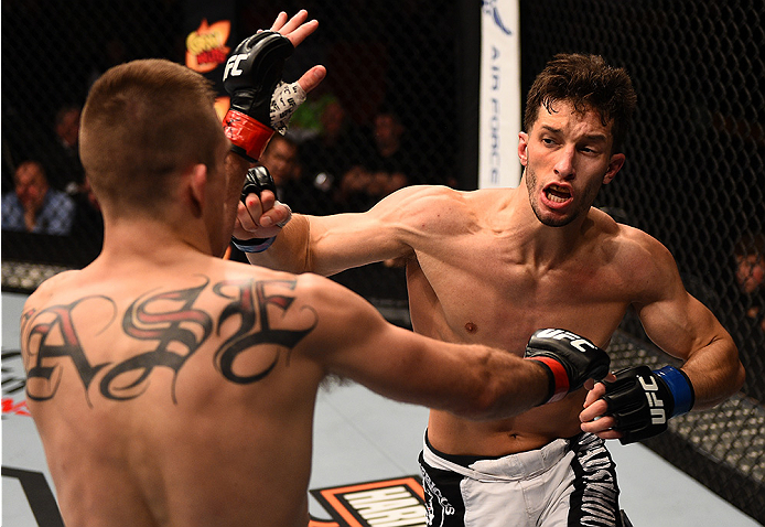 BOSTON, MA - JANUARY 18: (R-L) Frankie Perez punches Johnny Case in their lightweight fight during the UFC Fight Night event at the TD Garden on January 18, 2015 in Boston, Massachusetts. (Photo by Jeff Bottari/Zuffa LLC/Zuffa LLC via Getty Images)