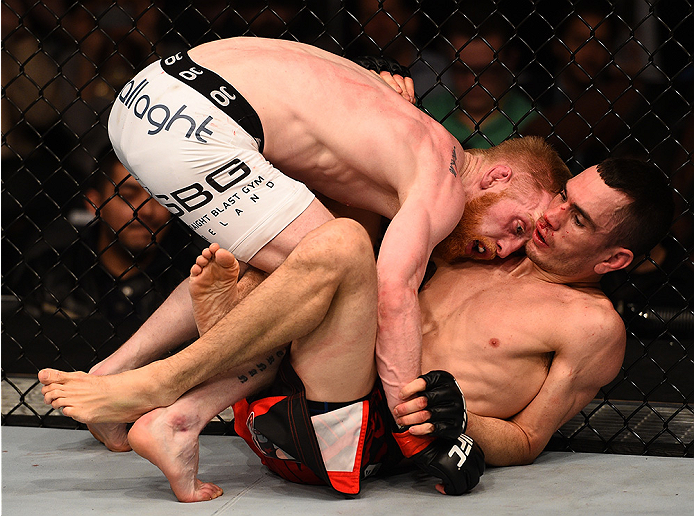 BOSTON, MA - JANUARY 18: (L-R) Paddy Holohan tackles Shane Howell in their flyweight fight during the UFC Fight Night event at the TD Garden on January 18, 2015 in Boston, Massachusetts. (Photo by Jeff Bottari/Zuffa LLC/Zuffa LLC via Getty Images)