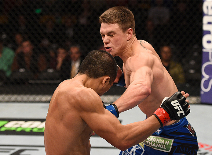 BOSTON, MA - JANUARY 18:  (R-L) Chris Wade punches Zhang Lipeng in their lightweight fight during the UFC Fight Night event at the TD Garden on January 18, 2015 in Boston, Massachusetts. (Photo by Jeff Bottari/Zuffa LLC/Zuffa LLC via Getty Images)