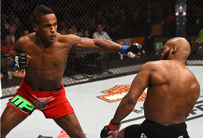 BOSTON, MA - JANUARY 18:  (L-R) Lorenz Larkin punches John Howard in their welterweight fight during the UFC Fight Night event at the TD Garden on January 18, 2015 in Boston, Massachusetts. (Photo by Jeff Bottari/Zuffa LLC/Zuffa LLC via Getty Images)