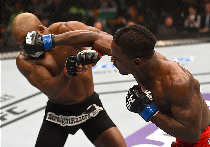 BOSTON, MA - JANUARY 18: (R-L) Lorenz Larkin punches John Howard in their welterweight fight during the UFC Fight Night event at the TD Garden on January 18, 2015 in Boston, Massachusetts. (Photo by Jeff Bottari/Zuffa LLC/Zuffa LLC via Getty Images)