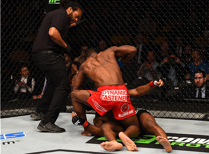 BOSTON, MA - JANUARY 18: Lorenz Larkin punches John Howard in their welterweight fight during the UFC Fight Night event at the TD Garden on January 18, 2015 in Boston, Massachusetts. (Photo by Jeff Bottari/Zuffa LLC/Zuffa LLC via Getty Images)