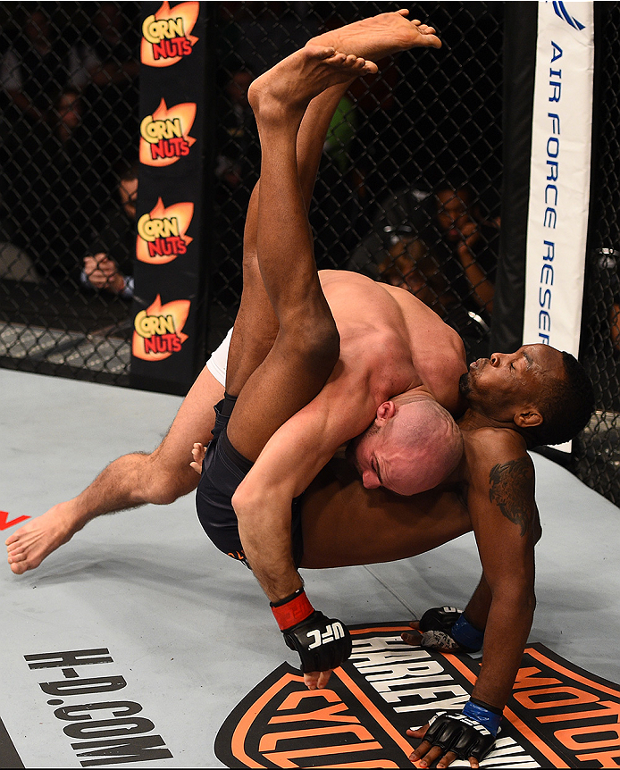BOSTON, MA - JANUARY 18: Cathal Pendred tackles Sean Spencer in their welterweight fight during the UFC Fight Night event at the TD Garden on January 18, 2015 in Boston, Massachusetts. (Photo by Jeff Bottari/Zuffa LLC/Zuffa LLC via Getty Images)