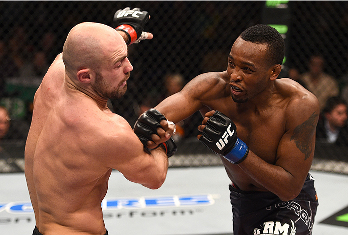 BOSTON, MA - JANUARY 18: (R-L) Sean Spencer punches Cathal Pendred in their welterweight fight during the UFC Fight Night event at the TD Garden on January 18, 2015 in Boston, Massachusetts. (Photo by Jeff Bottari/Zuffa LLC/Zuffa LLC via Getty Images)