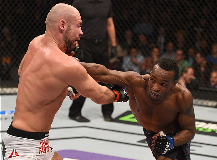 BOSTON, MA - JANUARY 18: (R-L) Sean Spencer punches Cathal Pendred in their welterweight fight during the UFC Fight Night event at the TD Garden on January 18, 2015 in Boston, Massachusetts. (Photo by Jeff Bottari/Zuffa LLC/Zuffa LLC via Getty Images)