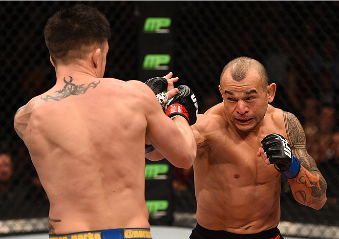 BOSTON, MA - JANUARY 18: (R-L) Gleison Tibau punches Norman Parke in their lightweight fight during the UFC Fight Night event at the TD Garden on January 18, 2015 in Boston, Massachusetts. (Photo by Jeff Bottari/Zuffa LLC/Zuffa LLC via Getty Images)