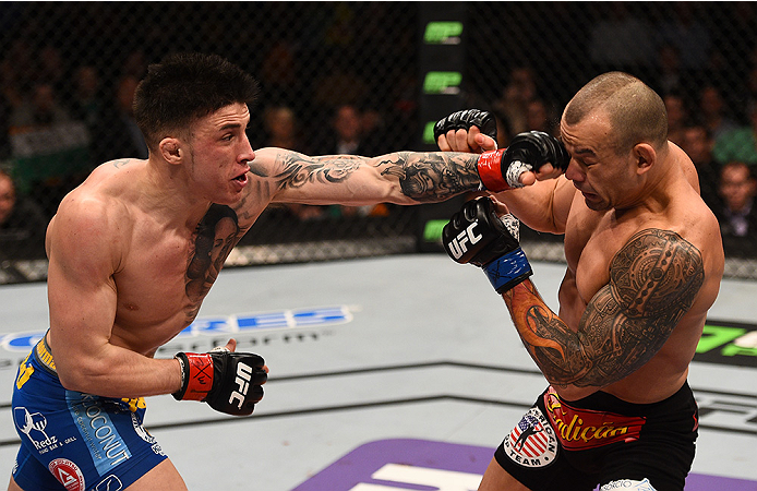 BOSTON, MA - JANUARY 18: (L-R) Norman Parke punches Gleison Tibau in their lightweight fight during the UFC Fight Night event at the TD Garden on January 18, 2015 in Boston, Massachusetts. (Photo by Jeff Bottari/Zuffa LLC/Zuffa LLC via Getty Images)