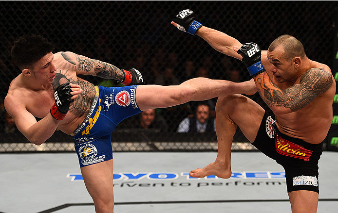 BOSTON, MA - JANUARY 18: (L-R) Norman Parke kicks Gleison Tibau in their lightweight fight during the UFC Fight Night event at the TD Garden on January 18, 2015 in Boston, Massachusetts. (Photo by Jeff Bottari/Zuffa LLC/Zuffa LLC via Getty Images)