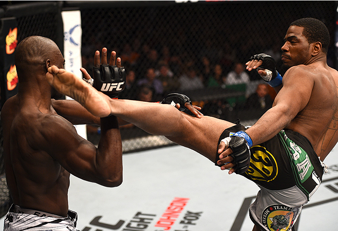 BOSTON, MA - JANUARY 18:  (R-L) Ron Stallings kicks Uriah Hall in their middleweight fight during the UFC Fight Night event at the TD Garden on January 18, 2015 in Boston, Massachusetts. (Photo by Jeff Bottari/Zuffa LLC/Zuffa LLC via Getty Images)