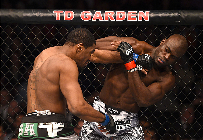 BOSTON, MA - JANUARY 18:  (L-R) Ron Stallings punches Uriah Hall in their middleweight fight during the UFC Fight Night event at the TD Garden on January 18, 2015 in Boston, Massachusetts. (Photo by Jeff Bottari/Zuffa LLC/Zuffa LLC via Getty Images)