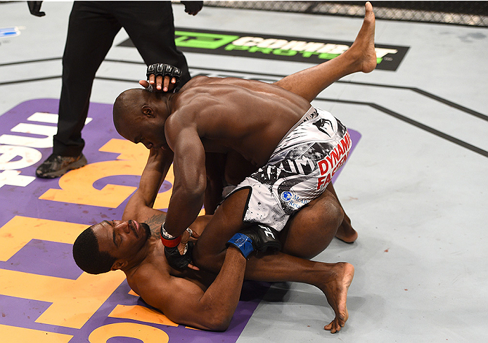 BOSTON, MA - JANUARY 18:  Uriah Hall punches Ron Stallings in their middleweight fight during the UFC Fight Night event at the TD Garden on January 18, 2015 in Boston, Massachusetts. (Photo by Jeff Bottari/Zuffa LLC/Zuffa LLC via Getty Images)