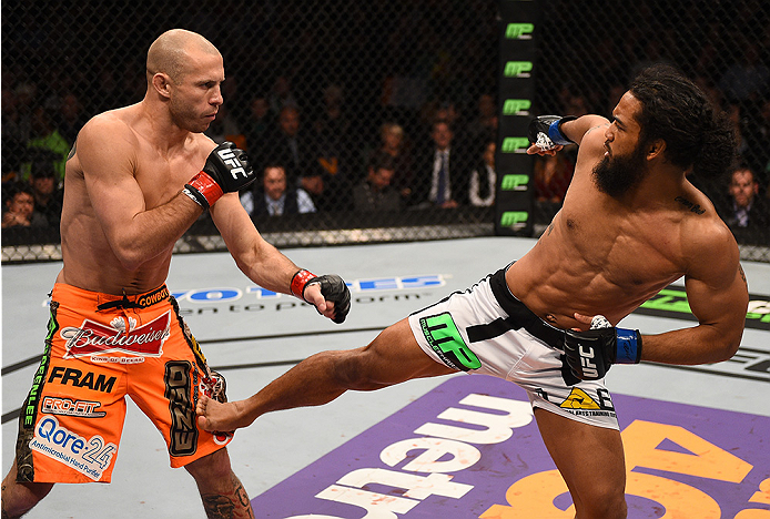 BOSTON, MA - JANUARY 18:  (R-L) Benson Henderson kicks Donald Cerrone in their lightweight fight during the UFC Fight Night event at the TD Garden on January 18, 2015 in Boston, Massachusetts. (Photo by Jeff Bottari/Zuffa LLC/Zuffa LLC via Getty Images)