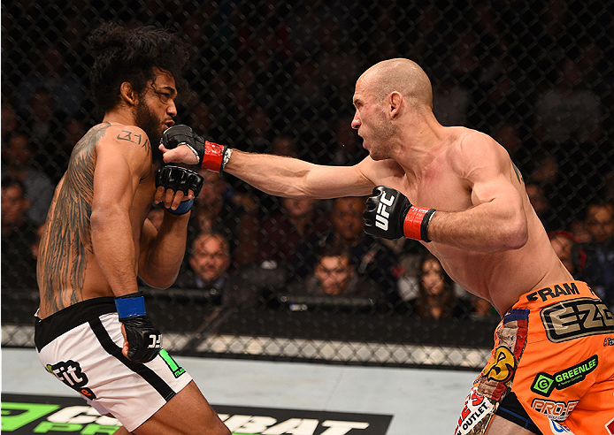 BOSTON, MA - JANUARY 18:  (R-L) Donald Cerrone punches Benson Henderson in their lightweight fight during the UFC Fight Night event at the TD Garden on January 18, 2015 in Boston, Massachusetts. (Photo by Jeff Bottari/Zuffa LLC/Zuffa LLC via Getty Images)