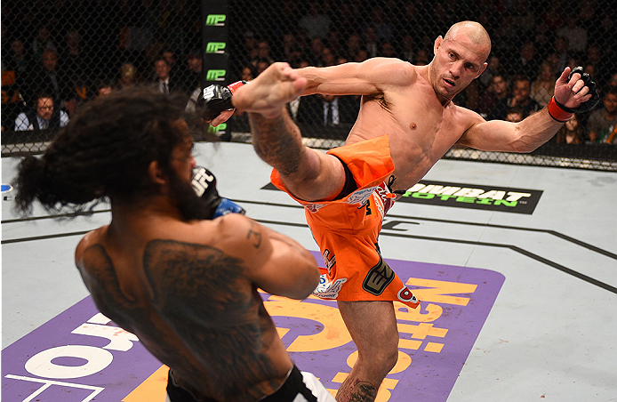 BOSTON, MA - JANUARY 18:  (R-L) Donald Cerrone kicks Benson Henderson in their lightweight fight during the UFC Fight Night event at the TD Garden on January 18, 2015 in Boston, Massachusetts. (Photo by Jeff Bottari/Zuffa LLC/Zuffa LLC via Getty Images)