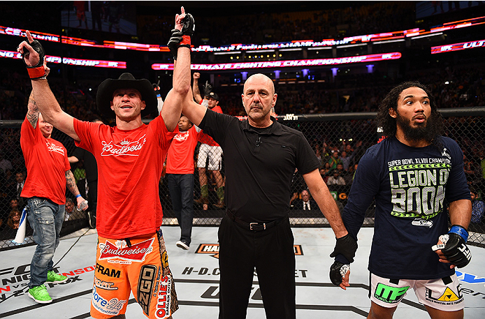 BOSTON, MA - JANUARY 18:  (L-R) Donald Cerrone and Benson Henderson react following their lightweight fight during the UFC Fight Night event at the TD Garden on January 18, 2015 in Boston, Massachusetts. (Photo by Jeff Bottari/Zuffa LLC/Zuffa LLC via Gett