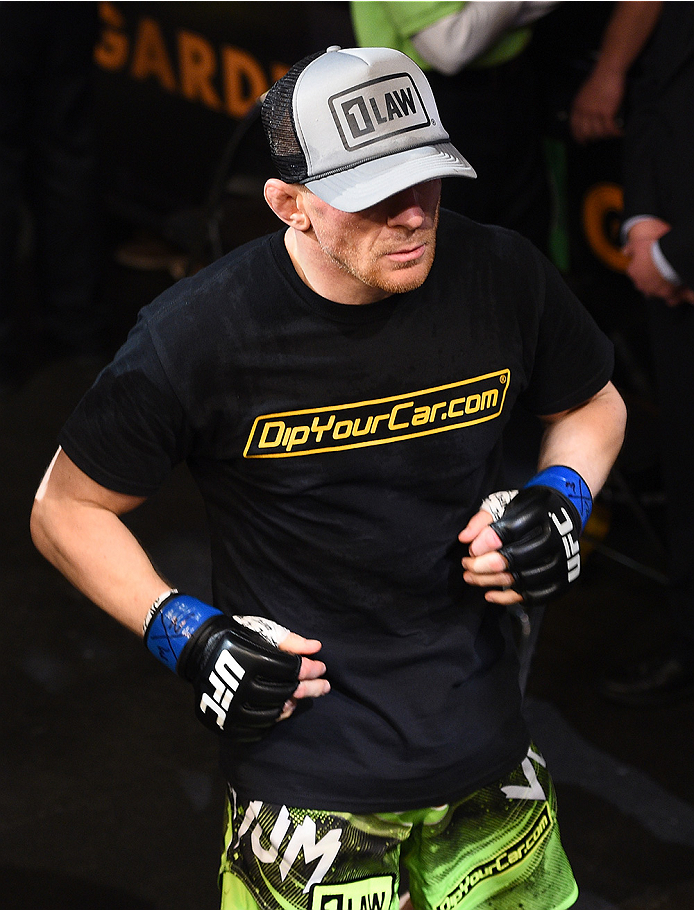 BOSTON, MA - JANUARY 18:  Dennis Siver of Germany enters the arena before a featherweight fight against Conor McGregor of Ireland during the UFC Fight Night event at the TD Garden on January 18, 2015 in Boston, Massachusetts. (Photo by Jeff Bottari/Zuffa 