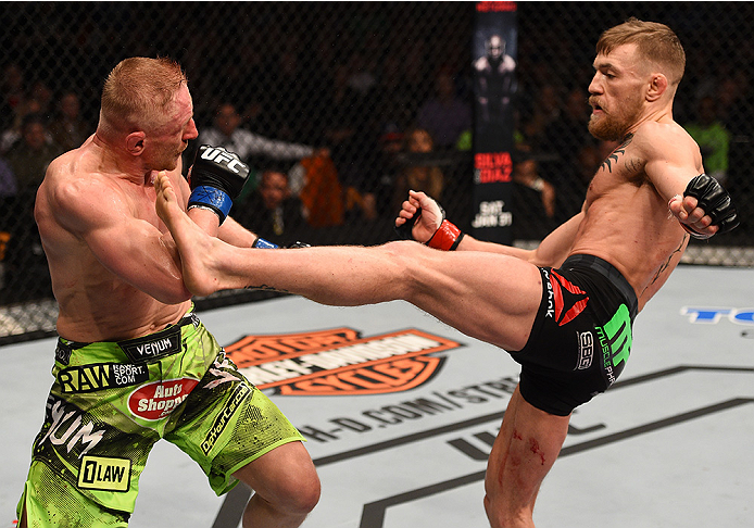 BOSTON, MA - JANUARY 18: Conor McGregor of Ireland kicks Dennis Siver of Germany in their featherweight fight during the UFC Fight Night event at the TD Garden on January 18, 2015 in Boston, Massachusetts. (Photo by Jeff Bottari/Zuffa LLC/Zuffa LLC via G