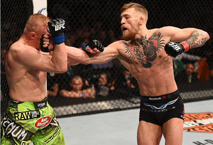 BOSTON, MA - JANUARY 18: Conor McGregor of Ireland punches Dennis Siver of Germany in their featherweight fight during the UFC Fight Night event at the TD Garden on January 18, 2015 in Boston, Massachusetts. (Photo by Jeff Bottari/Zuffa LLC/Zuffa LLC via