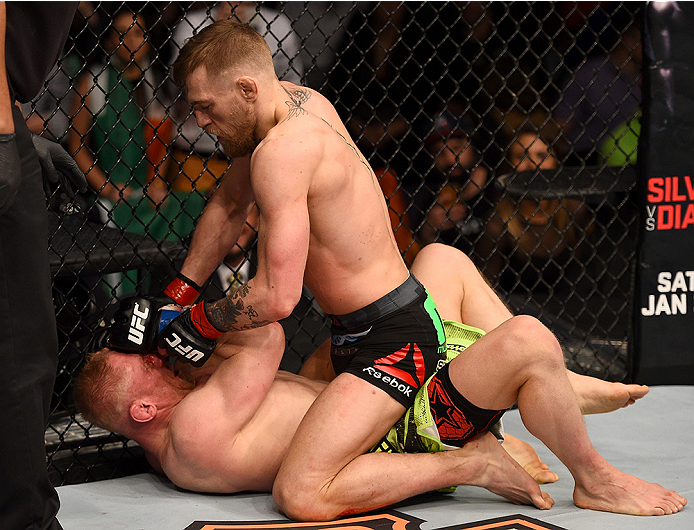 BOSTON, MA - JANUARY 18:  Conor McGregor of Ireland punches Dennis Siver of Germany in their featherweight fight during the UFC Fight Night event at the TD Garden on January 18, 2015 in Boston, Massachusetts. (Photo by Jeff Bottari/Zuffa LLC/Zuffa LLC via