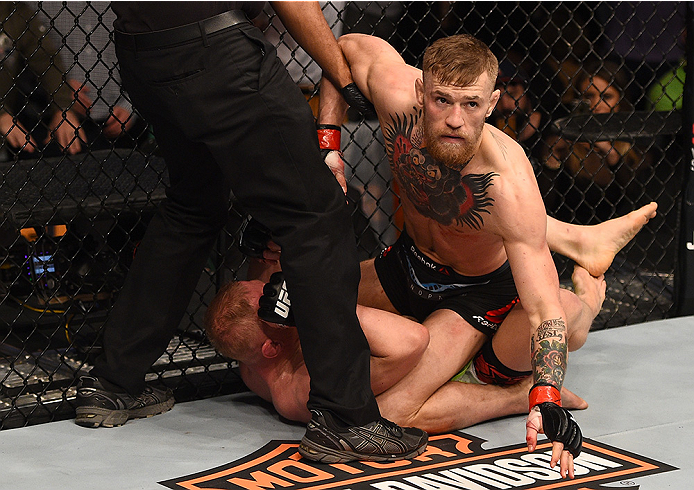 BOSTON, MA - JANUARY 18: Conor McGregor of Ireland reacts after punching Dennis Siver of Germany in their featherweight fight during the UFC Fight Night event at the TD Garden on January 18, 2015 in Boston, Massachusetts. (Photo by Jeff Bottari/Zuffa LLC
