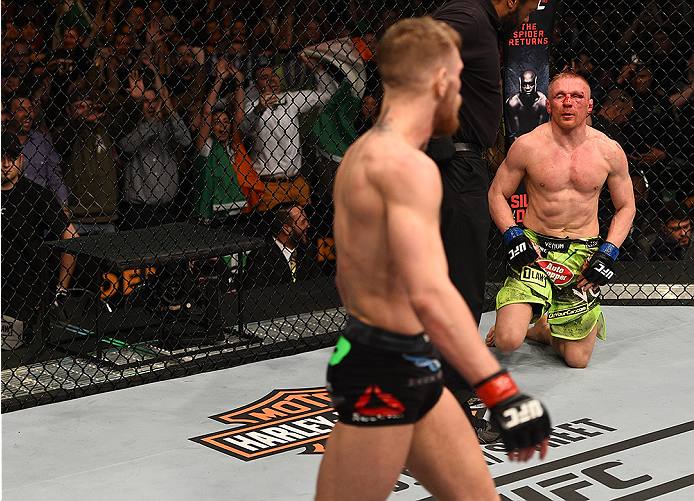 BOSTON, MA - JANUARY 18: Dennis Siver of Germany reacts after being defeated by Conor McGregor of Ireland in their featherweight fight during the UFC Fight Night event at the TD Garden on January 18, 2015 in Boston, Massachusetts. (Photo by Jeff Bottari/