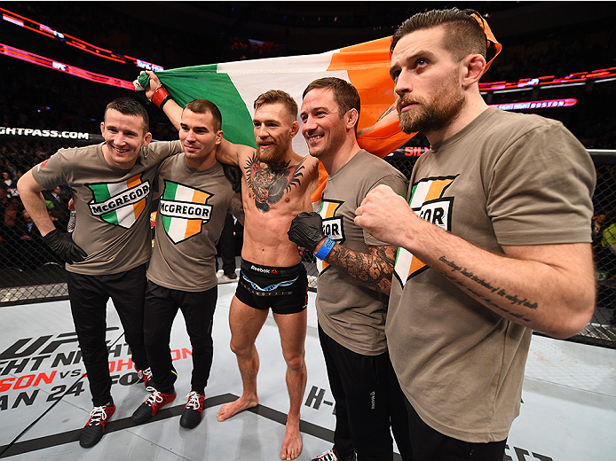 BOSTON, MA - JANUARY 18: Conor McGregor of Ireland celebrates with members of his team after defeating Dennis Siver of Germany in their featherweight fight during the UFC Fight Night event at the TD Garden on January 18, 2015 in Boston, Massachusetts. (P