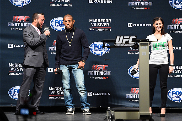 BOSTON, MA - JANUARY 17: UFC Featherweight Champion Jose Aldo (C) and UFC host Megan Olivi (R) interact with fans during a Q&A session before the UFC Fight Boston weigh-in event at the Orpheum Theatre on January 17, 2015 in Boston, Massachusetts. (Photo