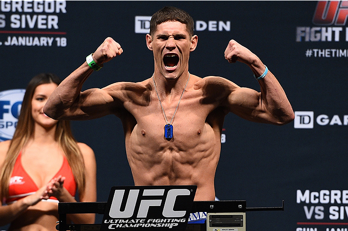 BOSTON, MA - JANUARY 17: Charles Rosa steps on the scale during the UFC Fight Night Boston weigh-in event at the Orpheum Theatre on January 17, 2015 in Boston, Massachusetts. (Photo by Jeff Bottari/Zuffa LLC/Zuffa LLC via Getty Images)